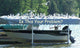 Dozens of gulls perched across the canopy of a boat hoist over open water, with a boat on the hoist below. Caption reads: Is this your problem?